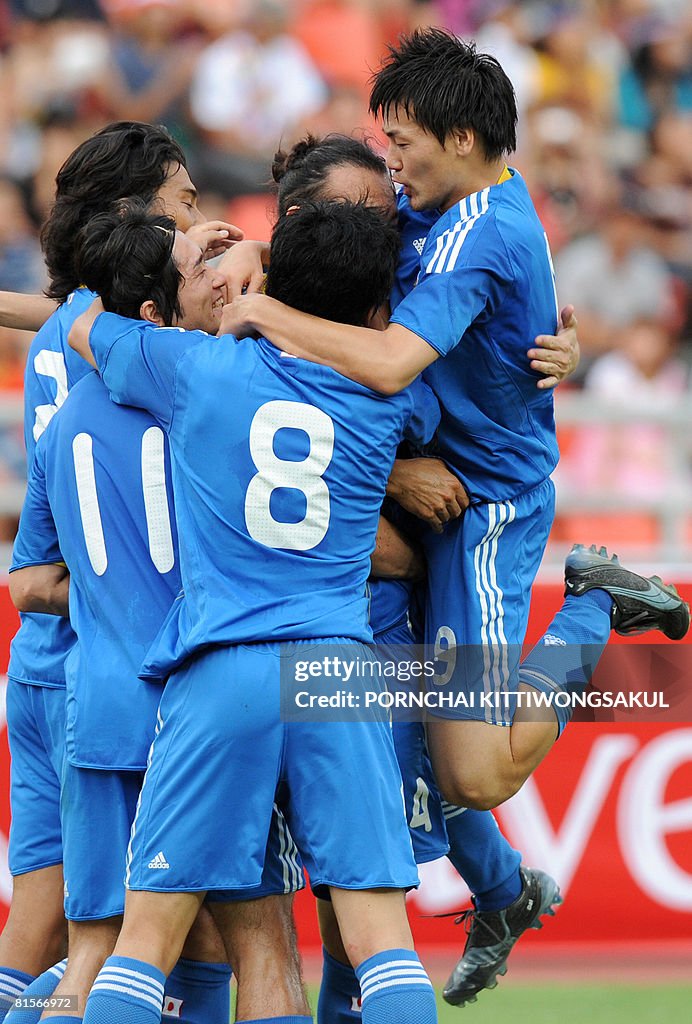 Japanese football players celebrates after scoring during the... News ...