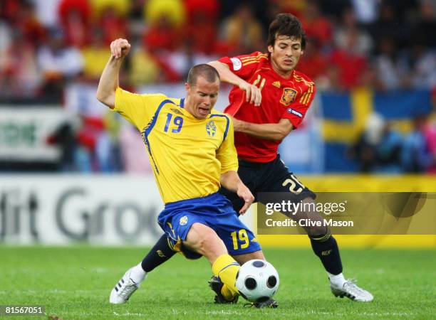 Daniel Andersson of Sweden is challenged by David Silva of Spain during the UEFA EURO 2008 Group D match between Sweden and Spain at Stadion Tivoli...