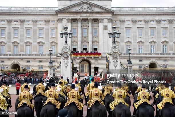 Royals stand on the balcony of Buckingham Palace as soldiers march past Queen Elizabeth II for Trooping The Colour celebrations on June 14, 2008 in...