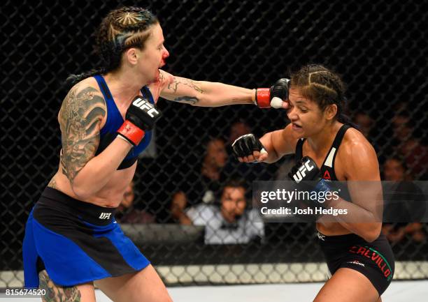 Joanne Calderwood of Scotland punches Cynthia Calvillo in their women's strawweight bout during the UFC Fight Night event at the SSE Hydro Arena...