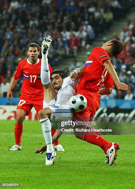 Nikos Liberopoulos of Greece attempts an overhead kick in front of Sergei Ignashevich of Russia during the UEFA EURO 2008 Group D match between...