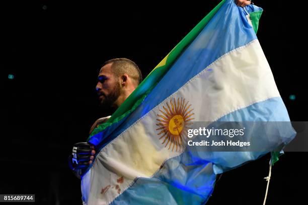 Santiago Ponzinibbio of Argentina celebrates his victory over Gunnar Nelson of Iceland in their welterweight bout during the UFC Fight Night event at...