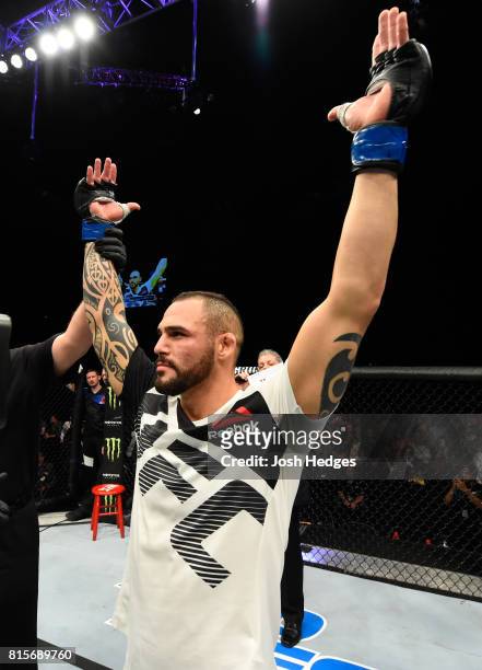 Santiago Ponzinibbio of Argentina celebrates his victory over Gunnar Nelson of Iceland in their welterweight bout during the UFC Fight Night event at...