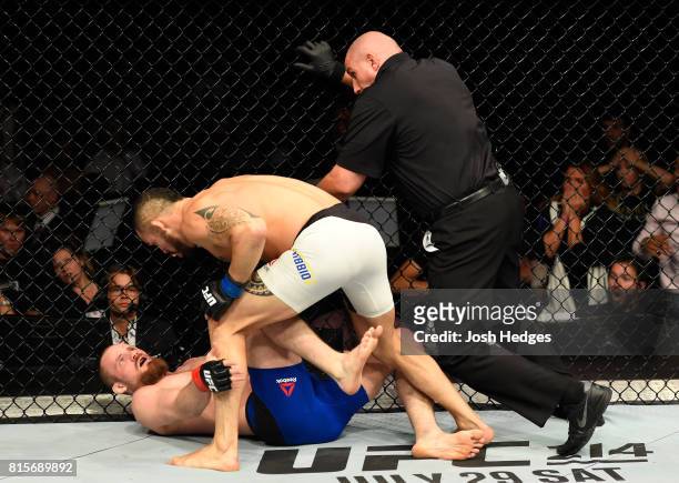 Santiago Ponzinibbio of Argentina punches Gunnar Nelson of Iceland in their welterweight bout during the UFC Fight Night event at the SSE Hydro Arena...