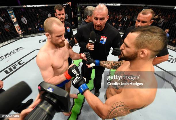 Gunnar Nelson of Iceland and Santiago Ponzinibbio of Argentina touch gloves in their welterweight bout during the UFC Fight Night event at the SSE...