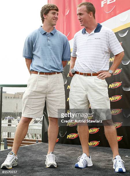 New York Giants quarterback Eli Manning and his brother Indianapolis Colts quarterback Peyton Manning attend the NERF Father's Day Football Throwdown...
