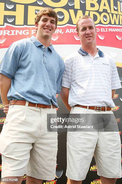 New York Giants quarterback Eli Manning and his brother Indianapolis Colts quarterback Peyton Manning attend the NERF Father's Day Football Throwdown...