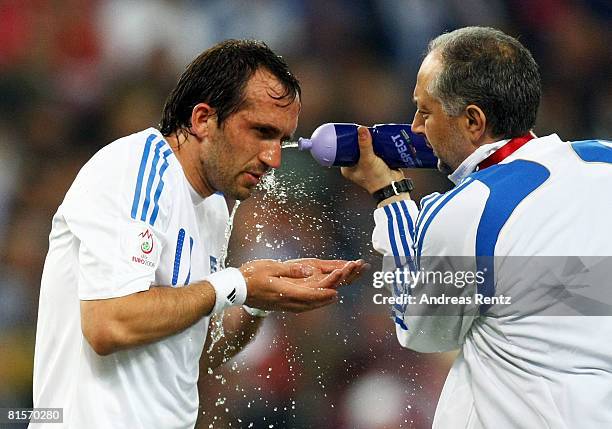 Theofanis Gekas of Greece is sprayed with water by medical staff during the UEFA EURO 2008 Group D match between Greece and Russia at Stadion...