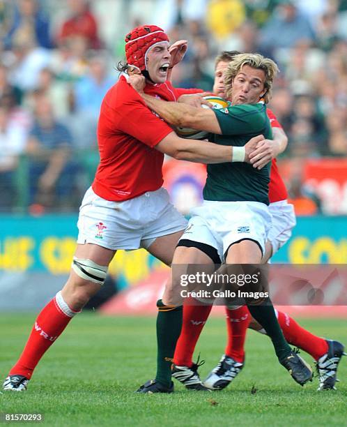 Alun-Wyn Jones of Wales tackles Percy Montgomery of South Africa during the second International Test match between South Africa and Wales held at...