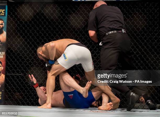 Gunner Nelson is knocked out by Santiago Ponzinibbio in the first round of their welterweight bout during the UFC Fight Night at the SSE Hyrdo,...