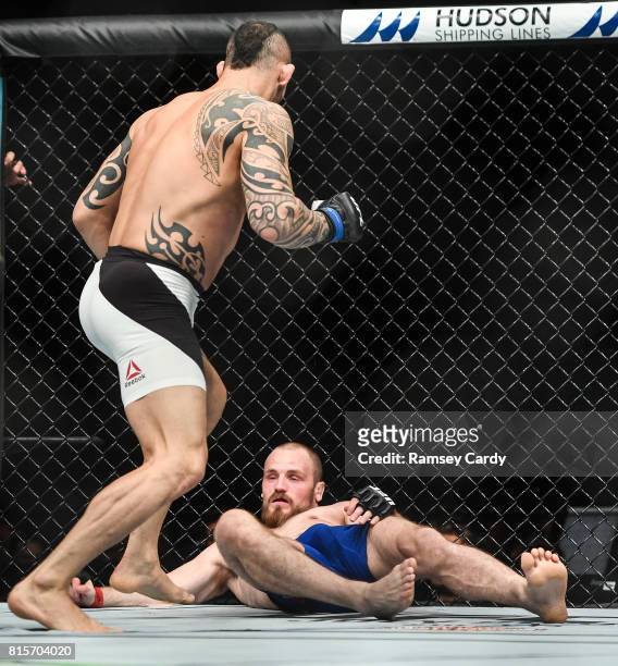 Glasgow , United Kingdom - 16 July 2017; Gunnar Nelson, right, is knocked out by Santiago Ponzinibbio in the first round of their welterweight bout...