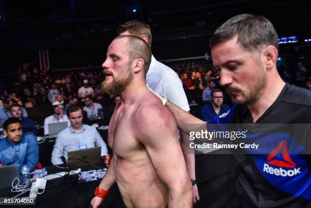 Glasgow , United Kingdom - 16 July 2017; Gunnar Nelson and coach John Kavanagh following his defeat to Santiago Ponzinibbio in their welterweight...