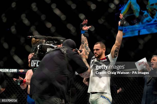 Santiago Ponzinibbio celebrates knocking out Gunner Nelson in the first round of their welterweight bout during the UFC Fight Night at the SSE Hyrdo,...
