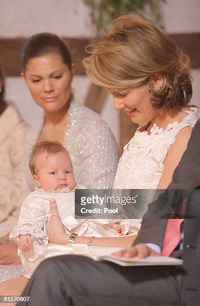 Princess Victoria of Sweden and Princess Mathilde of Belgium holding Princess Eleonore of Belgium during her baptism at the Chapel of Ciergnon Castle...