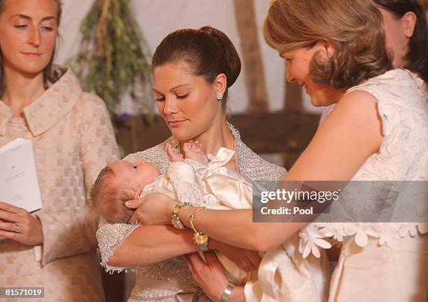 Princess Claire of Belgium, Princess Victoria of Sweden holding Princess Eleonore of Belgium and Princess Mathilde of Belgium participate in the...