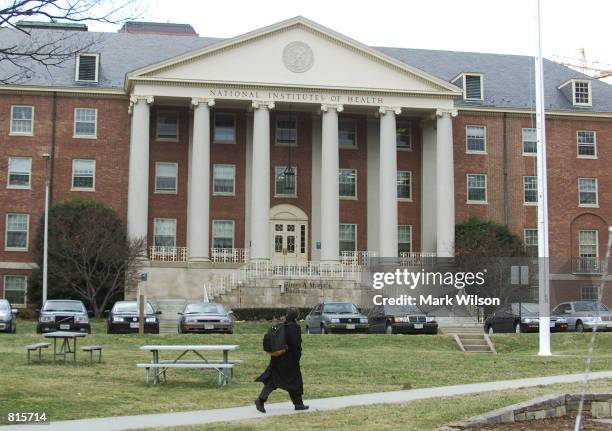 Man walks across the campus of the National Institutes of Health, March 9, 2001 in Bethesda, MD.