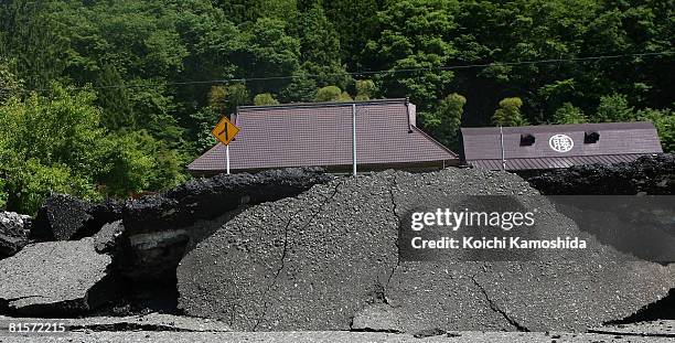 Road is heavily damaged by the magnitude 7.2 earthquake on June 15, 2008 in Ichinoseki, Iwate, Japan. At least 6 people died and ten were reported...