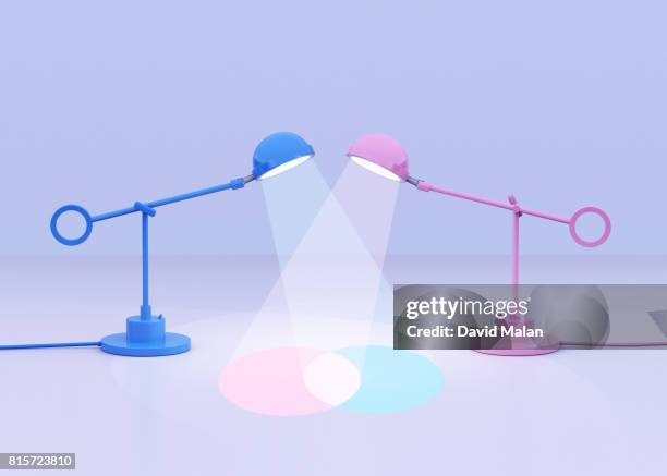 blue and pink lamps creating a venn diagram - venn diagramm stock-fotos und bilder