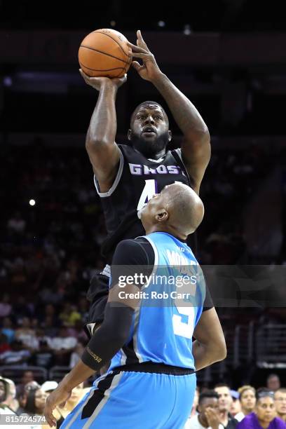 Ivan Johnson of the Ghost Ballers shoots against Cuttino Mobley of Power during week four of the BIG3 three on three basketball league at Wells Fargo...