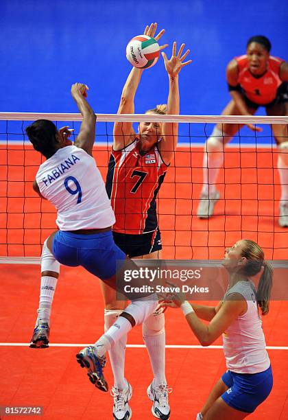 Heather Bown of USA blocks the shot of Fabiana Claudino of Brazil during the volleyball game between the USA Women's National Volleyball team and...