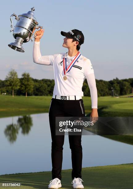 Sung Hyun Park of Korea poses with the trophy after the final round of the U.S. Women's Open on July 16, 2017 at Trump National Golf Club in...