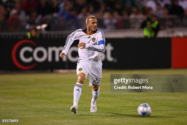 David Beckham of the Los Angeles Galaxy runs with the ball during their MLS game against the San Jose Earthquakes at McAfee Coliseum on June 14, 2008...