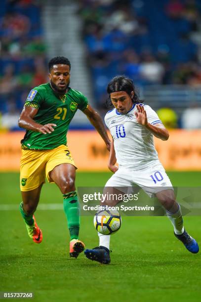 El Salvador midfielder Gerson Mayen tries to control the ball in front of Jamaica defender Jermaine Taylor during the CONCACAF Gold Cup soccer match...