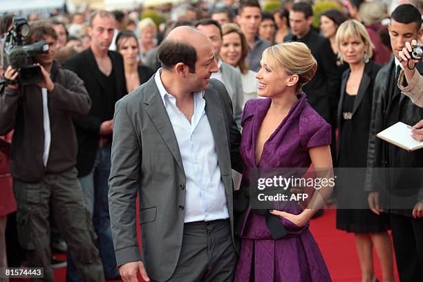 French actor Kad Merad and French actress Anne Marivin arrive at the 22nd Romantic Film festival ceremony in Cabourg, northwestern France, on June...