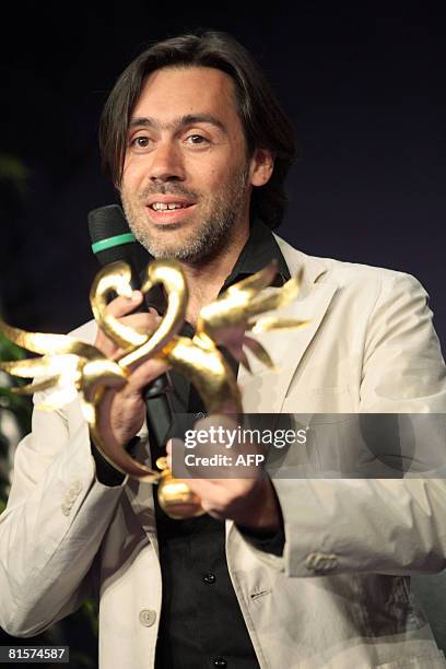 French director Emmanuel Mouret, Best Director Golden Swann for his film 'Un baiser s'il vous plait ' speaks to the audience after receiving the...