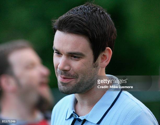 Dave Berry relaxes with friends backstage whilst his girlfriend Heidi Range performs with the Sugababes at the Isle of Wight Festival on June 14,...
