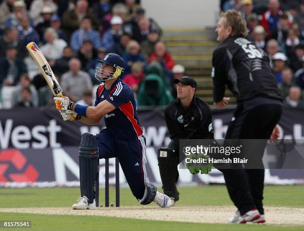 Kevin Pietersen of England reverse sweeps for six off the bowling of Scott Styris of New Zealand with Gareth Hopkins of New Zealand looking on during...