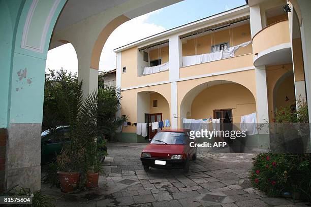 Car is parked in front of the house where a middle-aged woman was shut in by her family for 18 years, in Santa Maria Capua Vetere, north of Naples on...
