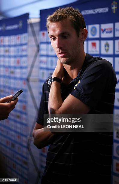Swedish goalkeeper Andreas Isaksson talks to members of the media following a training session at the Swedish training camp in Lugano, Switzerland on...