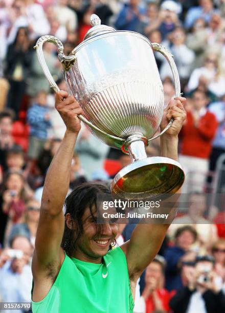 Rafael Nadal of Spain celebrates with the trophy after he won the Men's Singles Final match against Novak Djokovic of Serbia on Day 7 of the Artois...