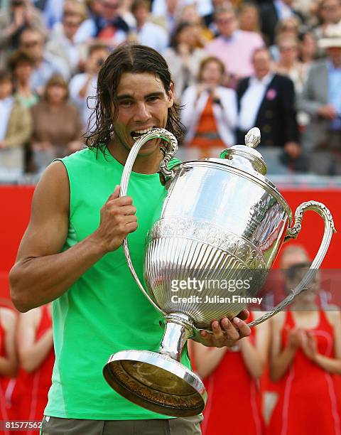 Rafael Nadal of Spain celebrates with the trophy following his victory during the Men's Singles Final match against Novak Djokovic of Serbia on Day 7...