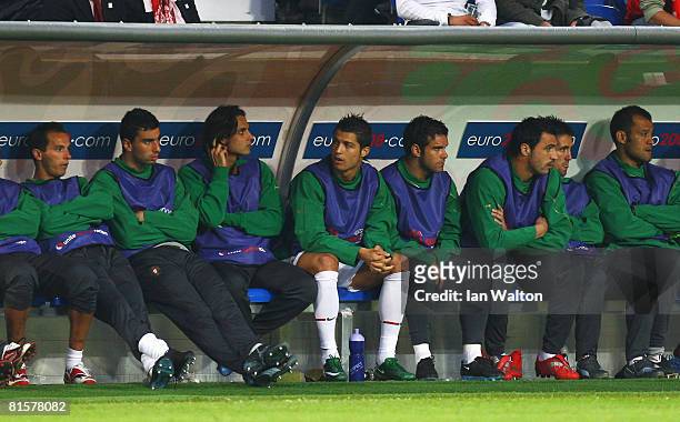 Cristiano Ronaldo of Portugal sits on the bench with team mates during the UEFA EURO 2008 Group A match between Switzerland and Portugal at St....