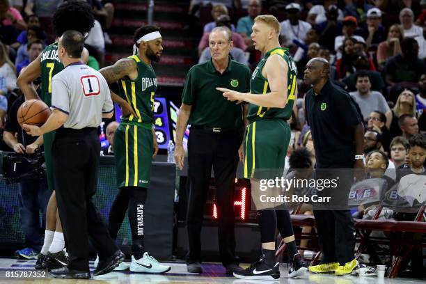 Coach Rich Barry of the Ball Hogs speaks to Xavier Silas and Brian Scalabrine in the game againest Trilogy during week four of the BIG3 three on...