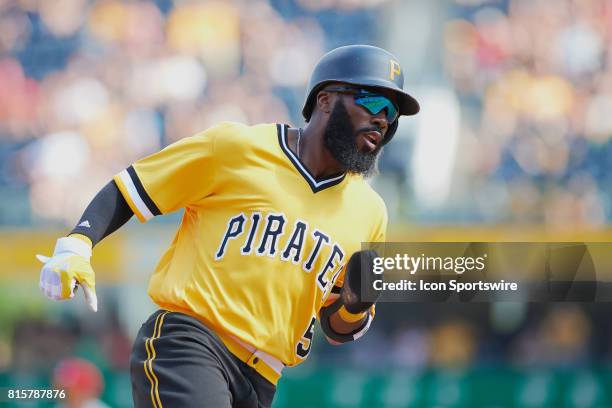 Pittsburgh Pirates second baseman Josh Harrison rounds third base and ties the game 3-3 during an MLB game between the Pittsburgh Pirates and the St....