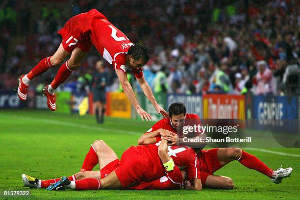Nihat Kahveci of Turkey is congratulated by team mates after scoring his team's third and winning goal during the UEFA EURO 2008 Group A match...