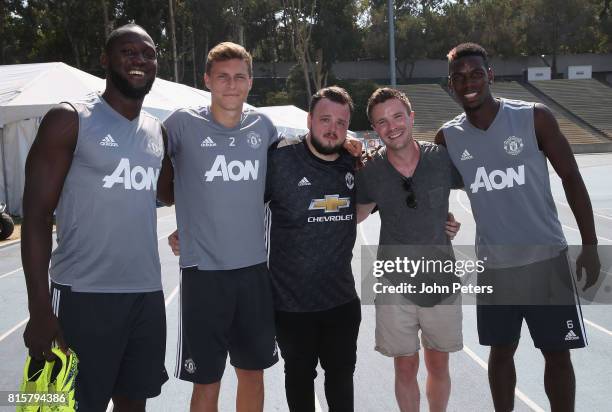Romelu Lukaku, Victor Lindelof and Paul Pogba of Manchester United pose with Game of Thrones actors John Bradley-West and Joe Dempsie ahead of a...