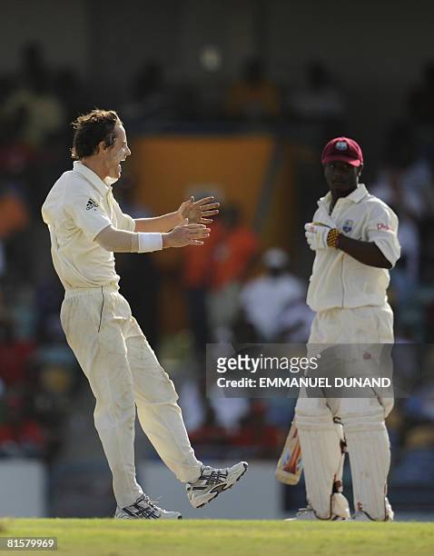 Australian bowler Beau Casson celebrates his first ever test wicket, taking out West Indies' batsman Xavier Marshall , during the fourth day of the...
