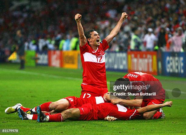 Nihat Kahveci of Turkey is congratulated by team mates after scoring his team's third and winning goal during the UEFA EURO 2008 Group A match...