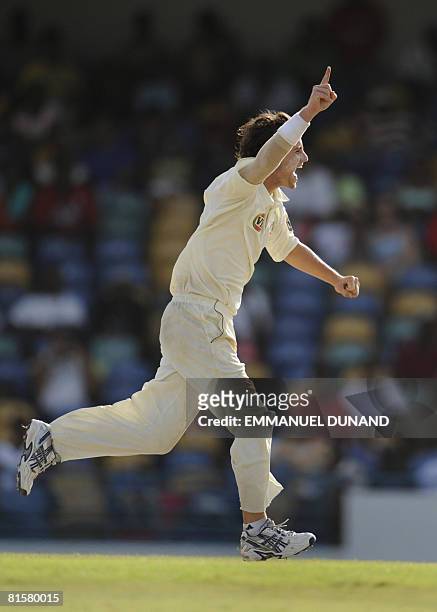 Australian bowler Beau Casson celebrates his first ever test wicket, taking out West Indies' batsman Xavier Marshall , during the fourth day of the...