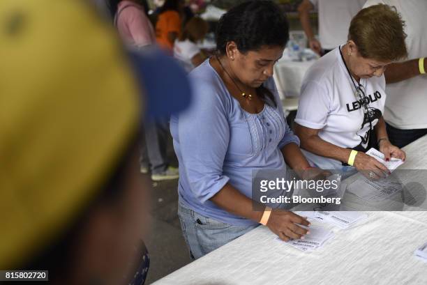 Volunteers count ballots during a symbolic Venezuelan plebiscite in the Chacao municipality of Caracas, Venezuela, on Sunday, July 16, 2017. Millions...