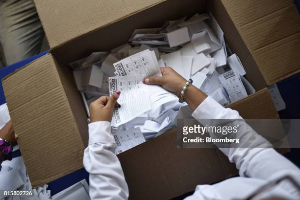 Volunteer counts ballots during a symbolic Venezuelan plebiscite in Chacao municipality in Caracas, Venezuela, on Sunday, July 16, 2017. Millions of...