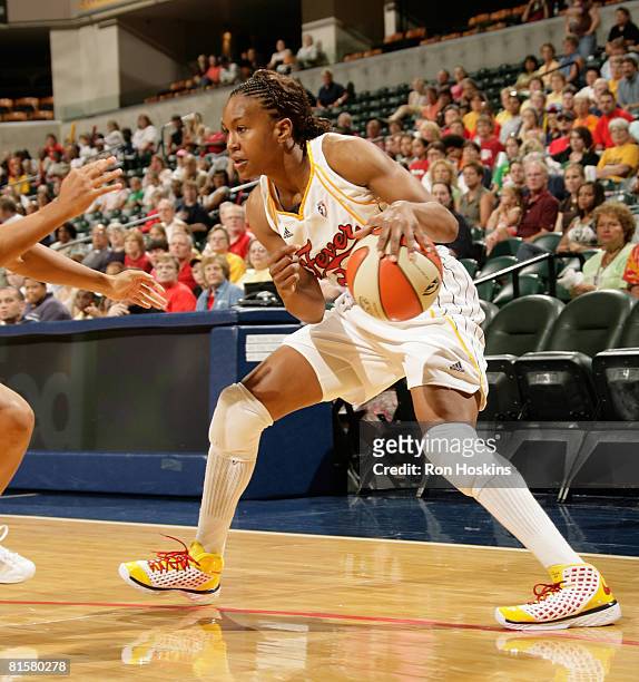 Tamika Catchings of the Indiana Fever makes a move on a San Antonio Silver Stars defender at Conseco Fieldhouse on June 15, 2008 in Indianapolis,...