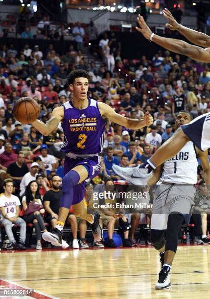 Lonzo Ball of the Los Angeles Lakers passes the ball under the basket against the Dallas Mavericks during a semifinal game of the 2017 Summer League...