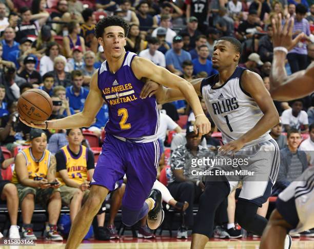 Lonzo Ball of the Los Angeles Lakers looks to pass the ball as he drives against Dennis Smith Jr. #1 of the Dallas Mavericks during a semifinal game...