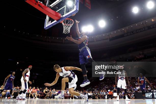 Andre Owens of 3's Company drives to the basket against Lou Amundson of Tri-State during week four of the BIG3 three on three basketball league at...