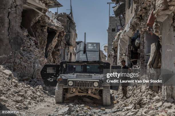 Humvee of the iraqi special forces in the district of the old city of Mosul recently freed from the presence of the fighters of the Islamic State,...